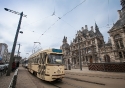 A traditional tram stopping outside the National Bank in Antwerp, Belgium