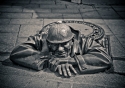 The bronze Peeper hidden in the streets of Bratislava, Slovakia