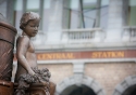 A cherub looks on outside Antwerp's Central Railway Station